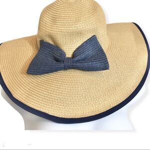 Flimsy straw hat blue trim attached bow quiet minimalist capsule raw quiet lux